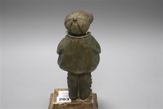 An Art Deco silver overlaid bronze and ivory figure of a boy wearing winter coat and cap, overall height 22cm, height of figure 19cm